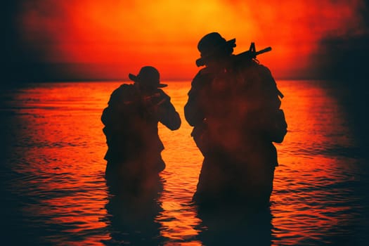 Commando soldiers walking in water, army special operations forces fighters sneaking in darkness, aiming assault rifles and observing shore during amphibious operation on coast at night or dawn