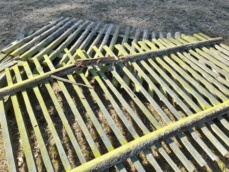 Old and broken wooden fence panels