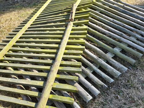 Old and broken wooden fence panels