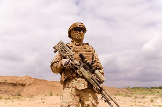 Equipped and armed special forces soldier with sniper rifle. Concept of military anti-terrorism operations, special operations of NATO forces.