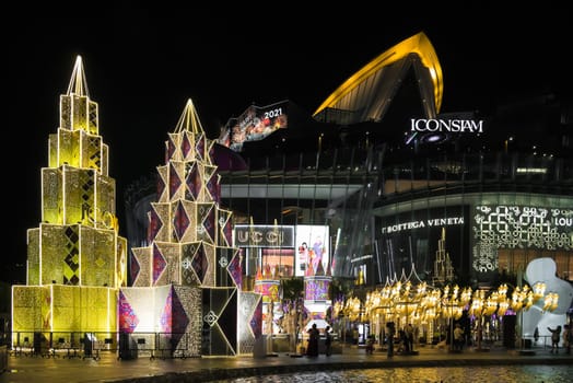 Bangkok, Thailand - December 22, 2020: Night illumination of Christmas and New Year celebration 2021 at Iconsiam luxury shopping mall in Bangkok, Thailand