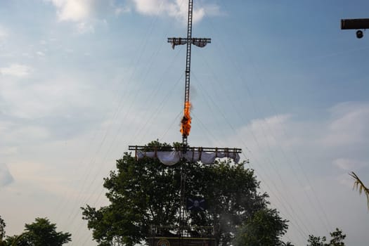 SEVENUM, LIMBURG, NETHERLANDS - JULY 17, 2019: Amusement park show event of a pirate race. A man spring burning from a mast Holland, Europe.