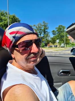 Handsome man in the car. Luxury life.