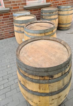 Detail view of stacked whisky and wine wooden barrels