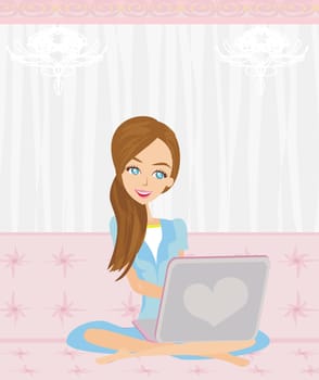 Woman with laptop on the sofa at home