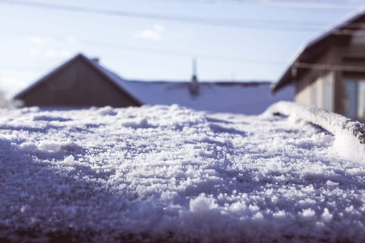 Close up of ice on a car rooftop