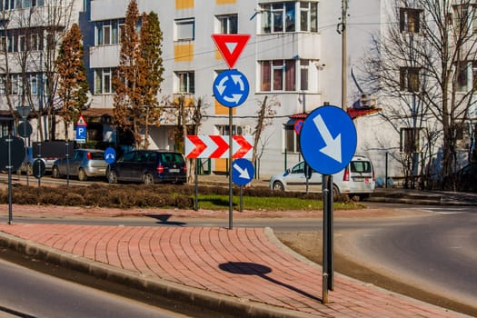 Iasi - Romania - 13th March 2021: Intersection with traffic signs during a sunny day