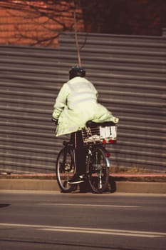 Cyclist going downhill on a road in Iasi, Romania