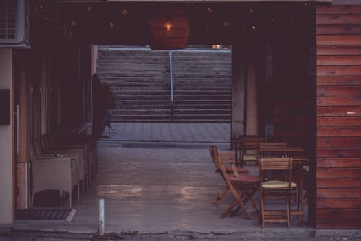 Vintage cozy restaurant on the sidewalk near apartments in Iasi, Romania