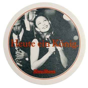 BERLIN, GERMANY - MARCH 15, 2015: Beermat of German beer Koenig Pilsner isolated over white background