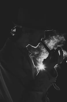 Black and white old-fashioned portrait of man with cigar