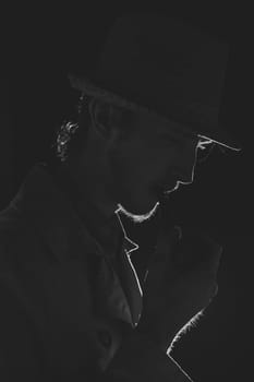 Black and white old-fashioned portrait of man with cigar