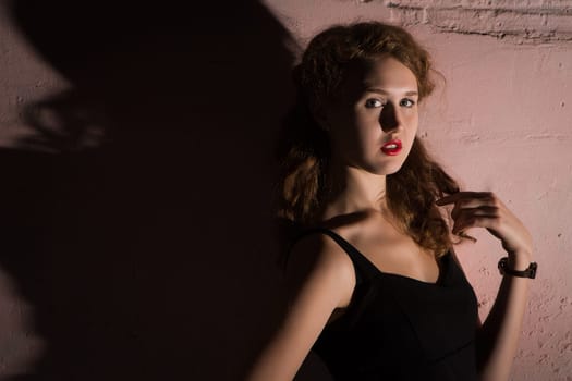 Noir portrait of attractive brunette girl