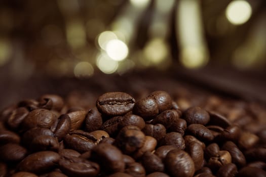 Coffee on grunge wooden background Fresh coffee beans on wood and linen bag, ready to brew delicious coffee