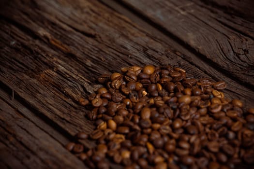Coffee on grunge wooden background Fresh coffee beans on wood and linen bag, ready to brew delicious coffee