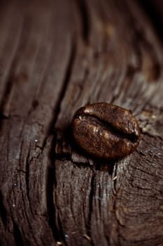 Coffee on grunge wooden background Fresh coffee beans on wood and linen bag, ready to brew delicious coffee