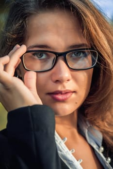 series. A portrait of the young business woman  in autumn park