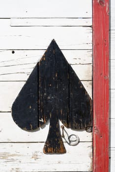 wooden door with play card pattern