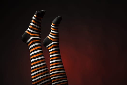 Pretty legs in a long multi-colored socks
