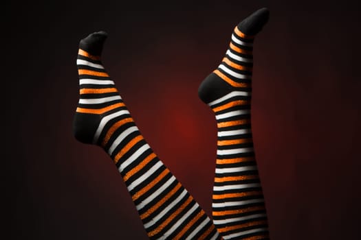Pretty legs in a long multi-colored socks