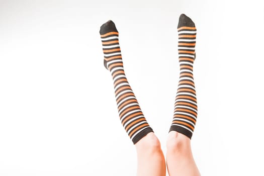 Pretty legs in a long multi-colored socks