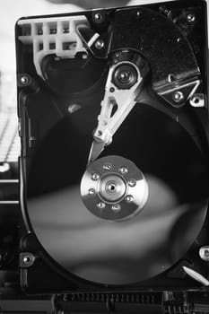 close up of hard disk with abstract reflection