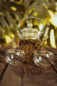 Hot glass of tea on wood table