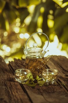 Hot glass of tea on wood table