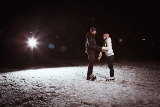 Beautiful, attractive couple on the ice rink