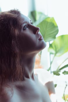 Beautiful brunette lady posing in bleached light