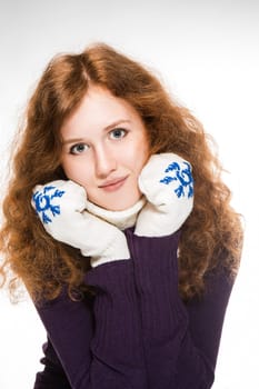 beautiful woman dressed in winter clothes smiling - studio shots