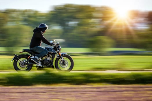 Riding motorcycle pan technic used., panning photo. copyspace for your individual text.