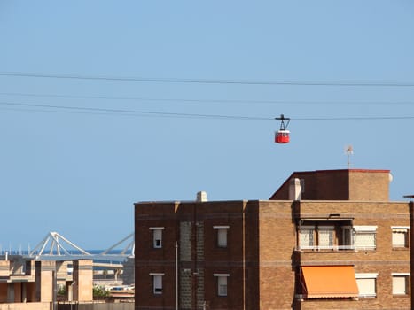 Cable Car over Barcelona City in Spain with Blue Sky Background