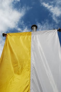 The yellow and white church flag of the Catholic Church is hoisted on many festive days such as First Communion,Confirmation,Easter,Pentecost and Christmas.