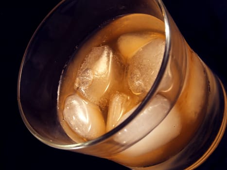 Glass of alcoholic drink with ice