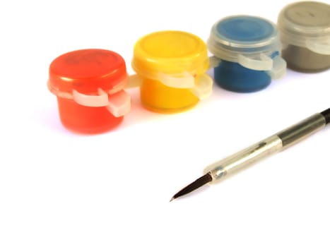 Gouache paint cans and paint brush isolated on white background
