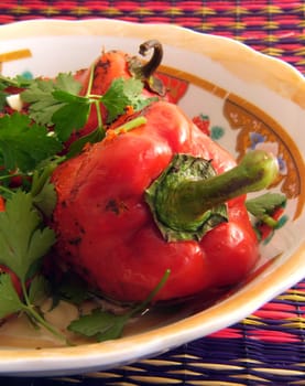 Salad of paprika and parsley served in plate