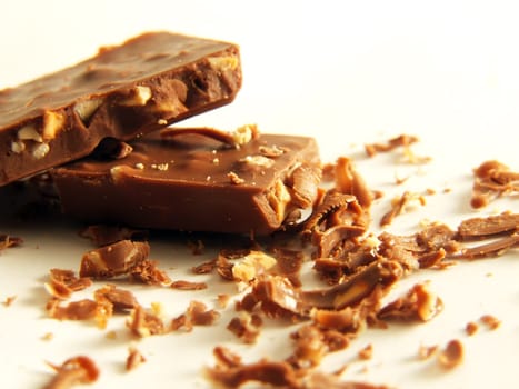 crumbled chocolate with hazelnuts over white