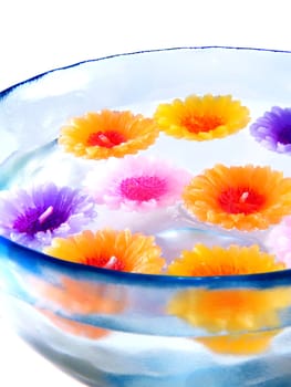 aromatherapy candles in a bowl with water