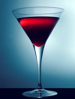 Cocktail glass with red beverage