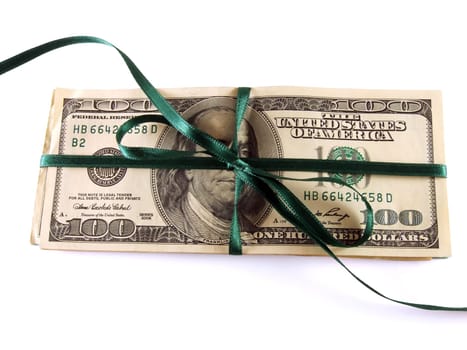 one hundred dollar bills wrapped with a green ribbon