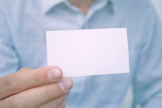 closeup of blank card in man's hand