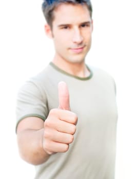 Young optimistic man showing his thumb up