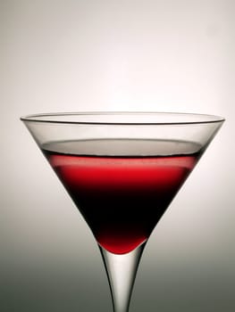 Cocktail glass with red beverage
