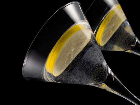 martini with lemon over black