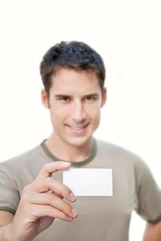 Smiling man holding empty card in his hand