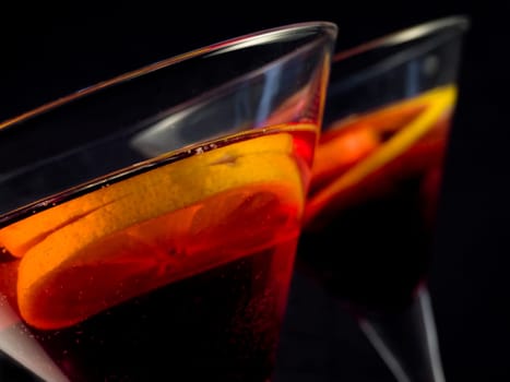 cocktail with lemon over black