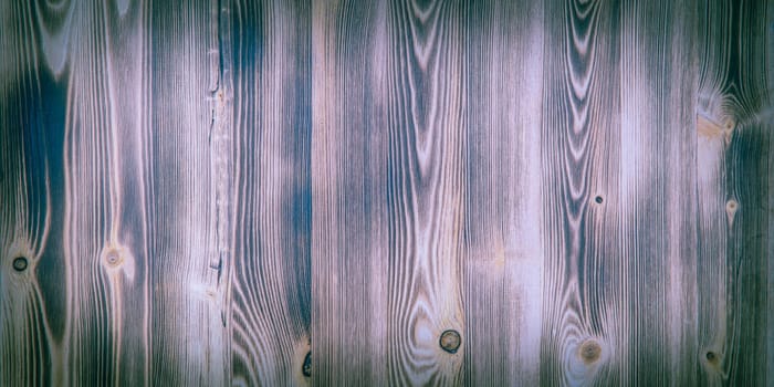 Old wooden background with purple horizontal boards. layout, space for text and logo.