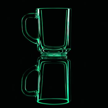 Just a glass on a black background with a reflection. Green colors. Isolated.