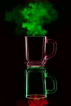Just a glass on a black background with a reflection. Red and green, with steam. Isolated.